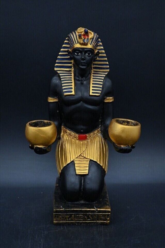 Ancient Egyptian statue King Tutankhamun seated offering offerings to gods BC